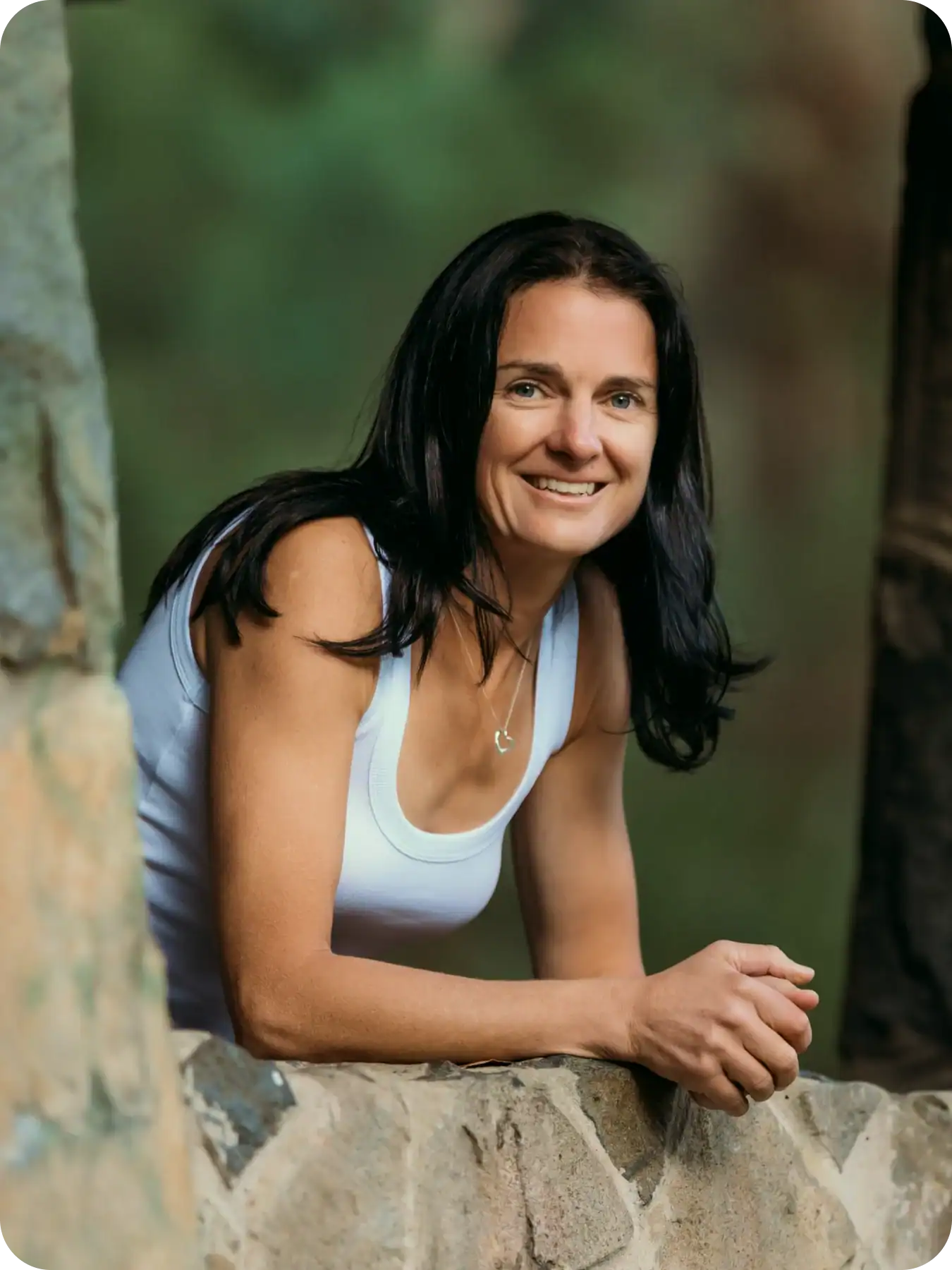 Anna Baylis smiling outdoors representing her journey into life coaching and personal development
