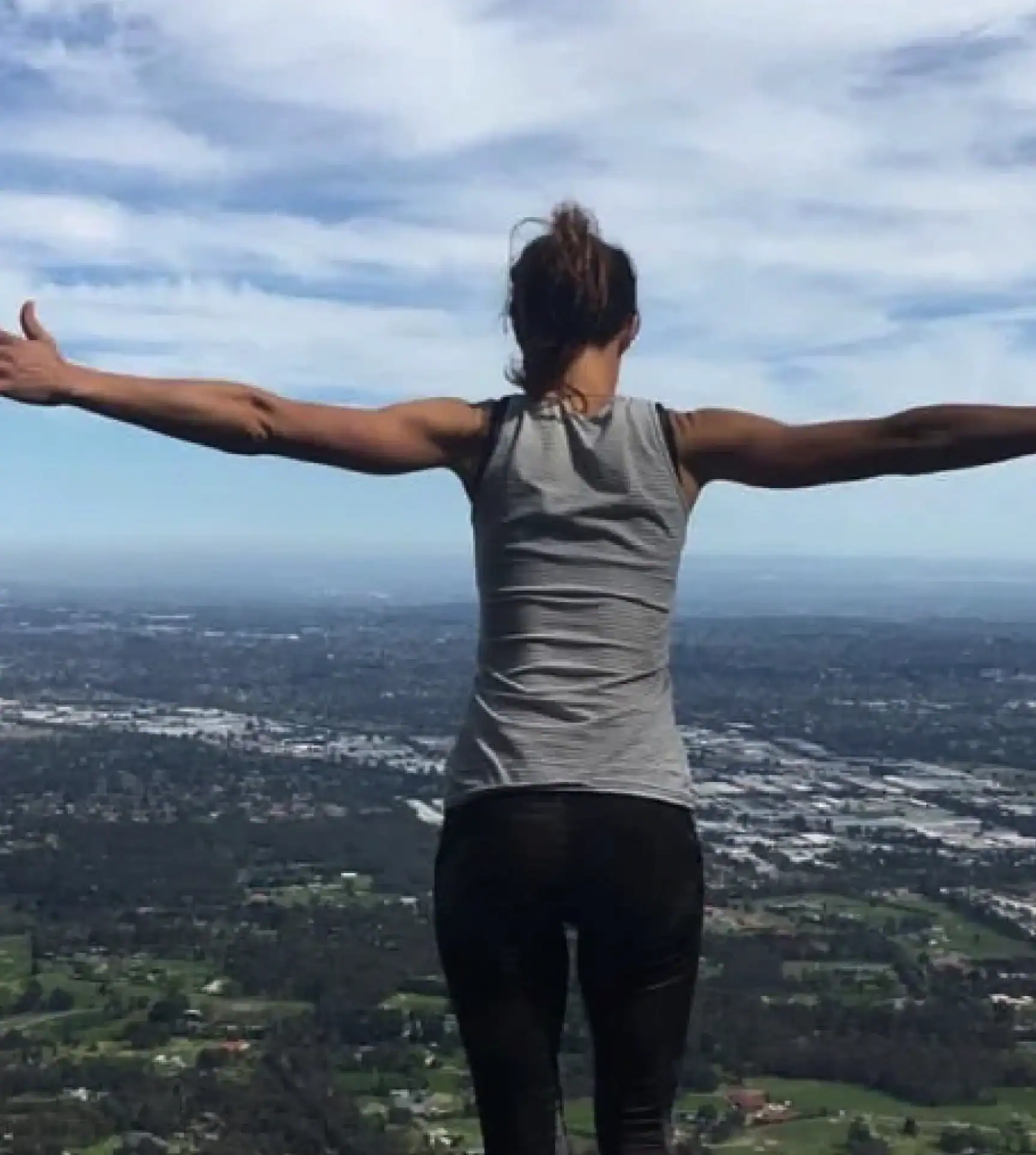 Anna Baylis meditating in the mountains promoting inner health